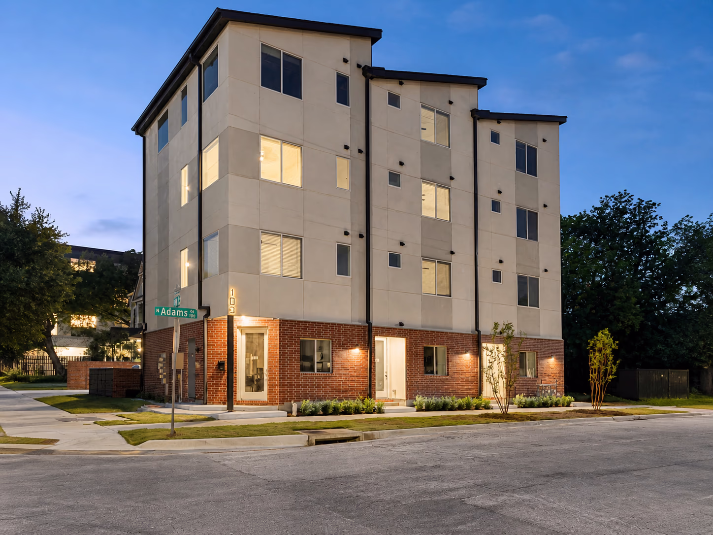 Mosaic Suites townhomes exterior at night in Bishop Arts, Dallas